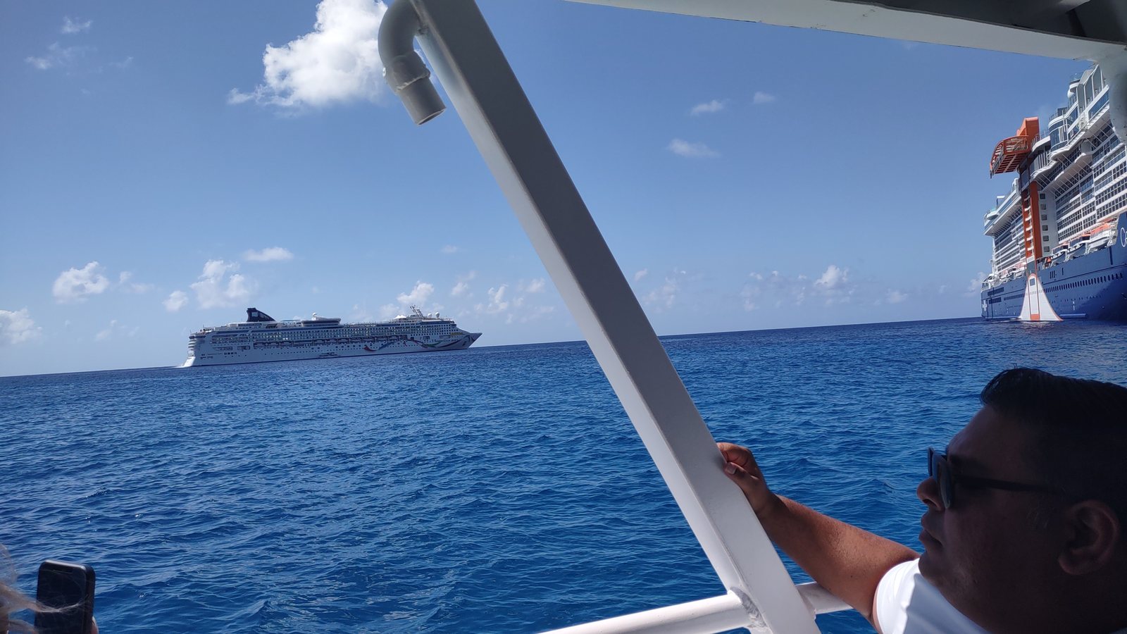 The view from inside a tender boat at Grand Cayman, with cruise ships anchored offshore